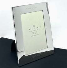 Personalized silver plated 5x7 photo frame with wide border engraved with names and date
