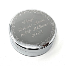 Personalized silver round jewelry box with engraved text on the lid