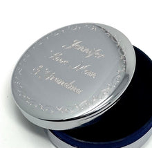 Silver jewelry box with blue velvet interior and engraved lid