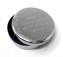 Silver round jewelry box engraved with a three-line message