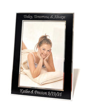 Personalized photo frame with silver engraving on the black border