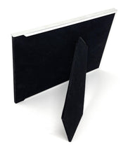 Black and silver engraved photo frame displayed with a photo